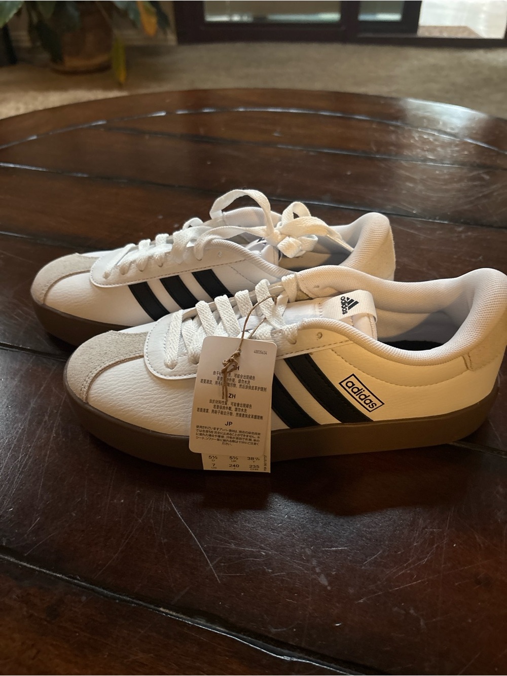 adidas Women’s White Sneakers with Black Stripes and Gum Sole